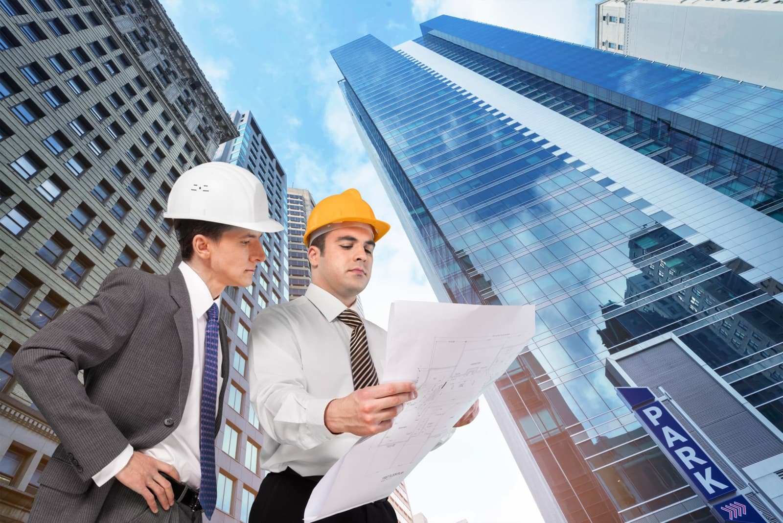 Construction crew reviewing plans on an active job site